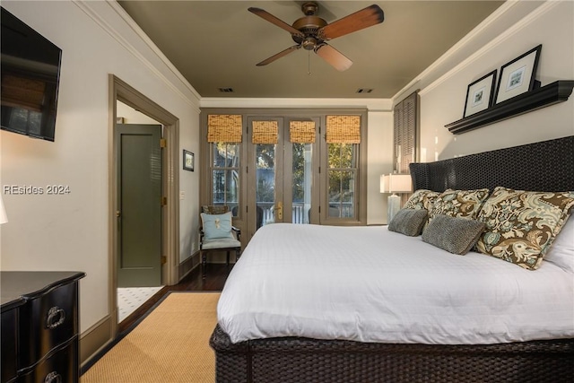 bedroom featuring ceiling fan, ornamental molding, and dark hardwood / wood-style floors