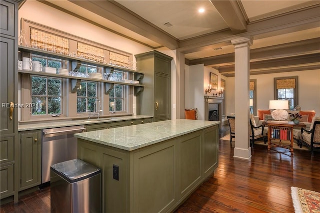 kitchen featuring decorative columns, light stone counters, green cabinetry, a kitchen island, and stainless steel dishwasher