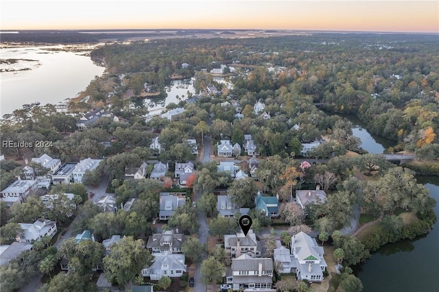 aerial view at dusk with a water view