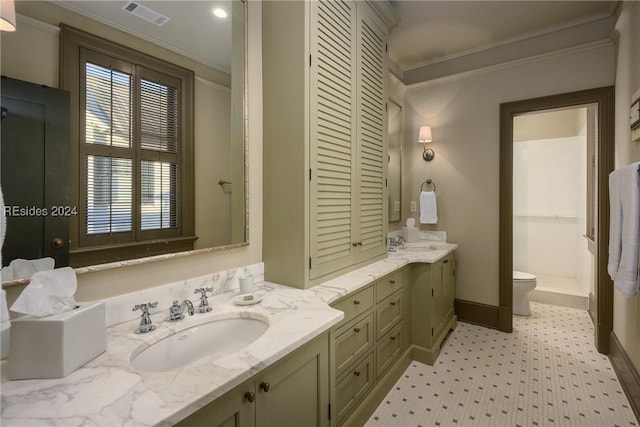 bathroom featuring vanity, crown molding, plenty of natural light, and toilet