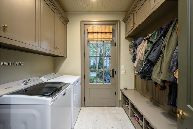 washroom featuring cabinets and independent washer and dryer