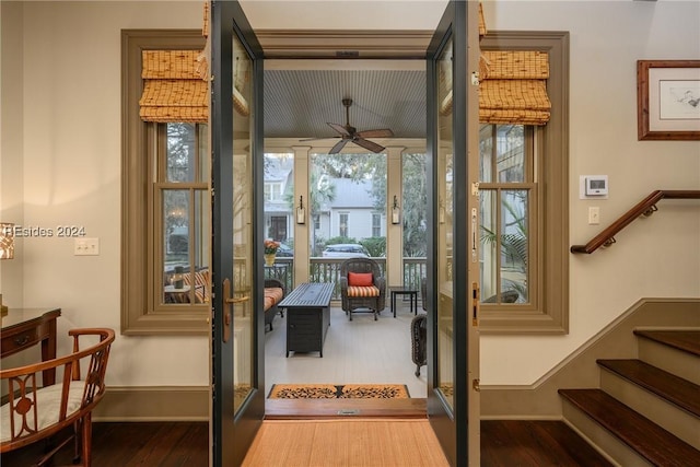 doorway to outside with hardwood / wood-style flooring and ceiling fan