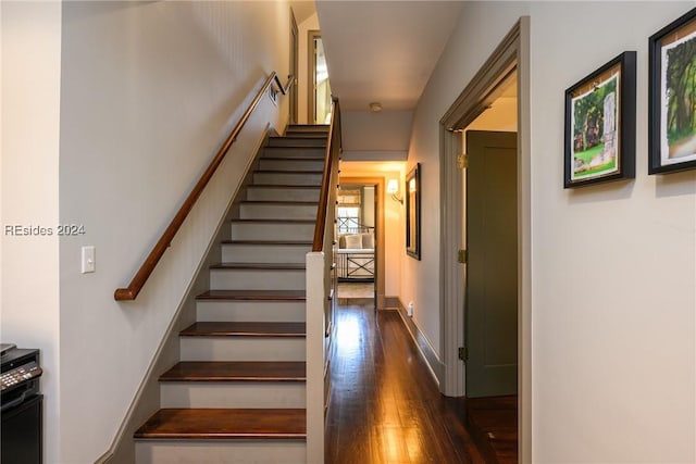 stairs with wood-type flooring