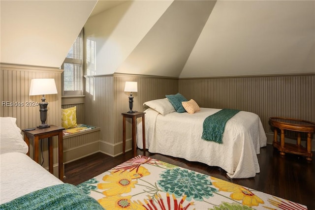 bedroom featuring dark hardwood / wood-style flooring and vaulted ceiling