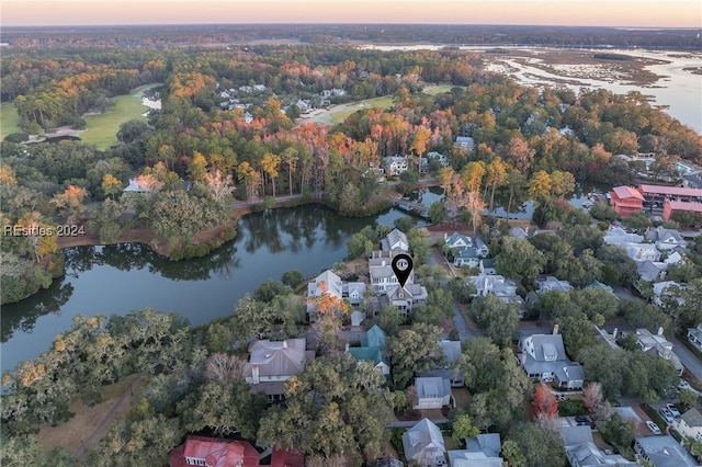 aerial view at dusk with a water view