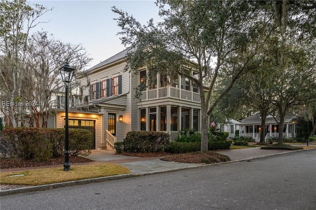 view of front of house with a sunroom