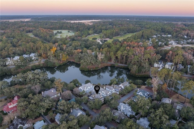 aerial view at dusk with a water view