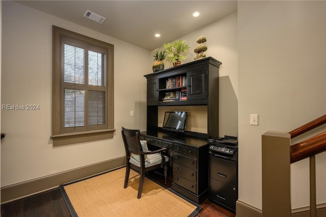 office space with dark wood-type flooring