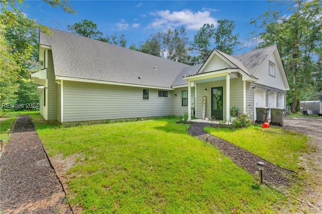 view of front of home featuring a garage and a front lawn