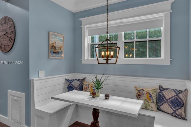 dining area with a notable chandelier and breakfast area