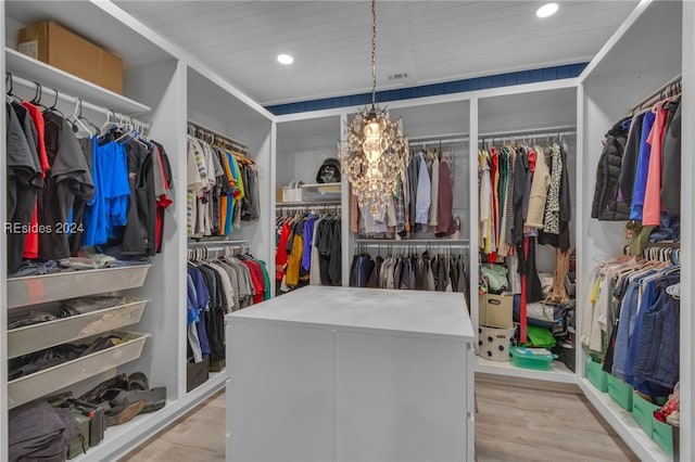 spacious closet with light hardwood / wood-style floors