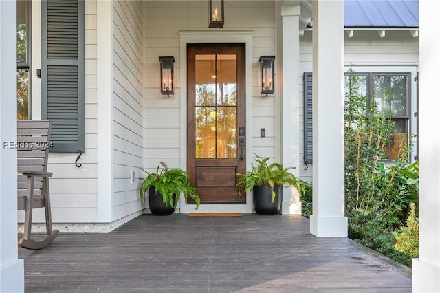 entrance to property with a porch