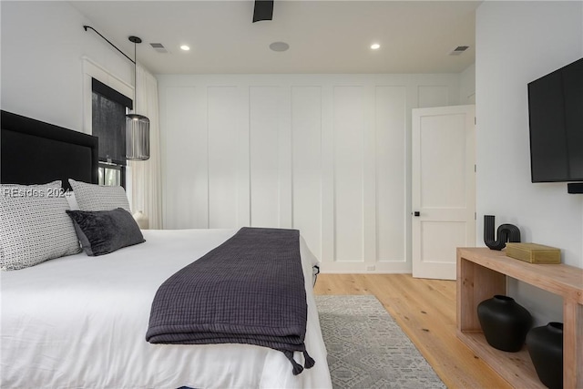 bedroom featuring ceiling fan and light wood-type flooring