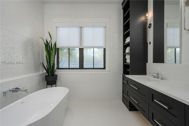 bathroom with vanity and a bathtub