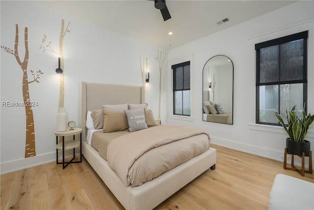 bedroom featuring ceiling fan and light hardwood / wood-style floors