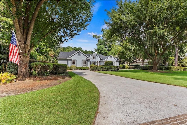 ranch-style house featuring a front yard