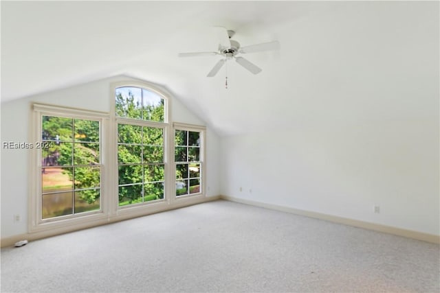 additional living space featuring ceiling fan, lofted ceiling, and light carpet