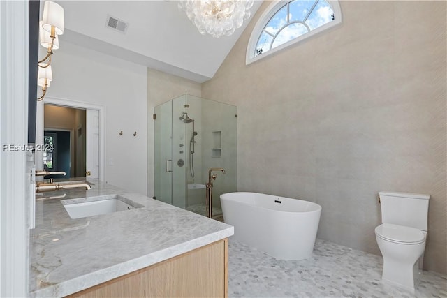 full bathroom featuring high vaulted ceiling, independent shower and bath, vanity, a notable chandelier, and toilet