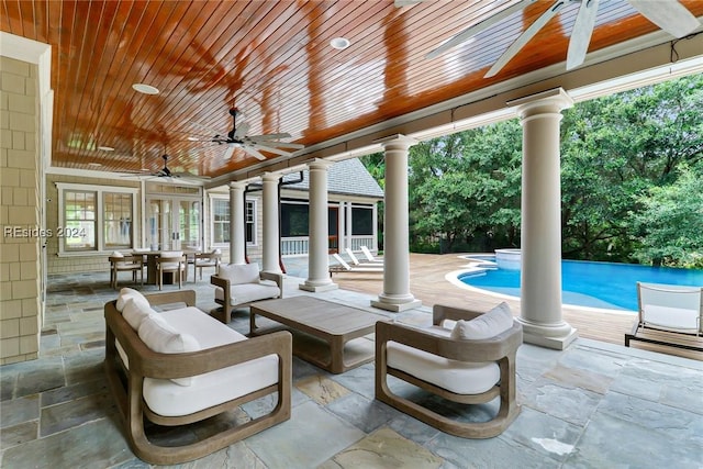 view of patio / terrace with an outdoor living space and ceiling fan