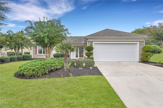 view of front of home featuring a garage and a front lawn