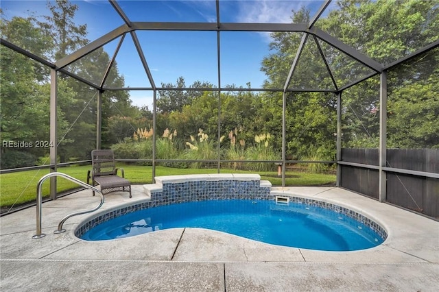 view of pool with a lanai and a patio area