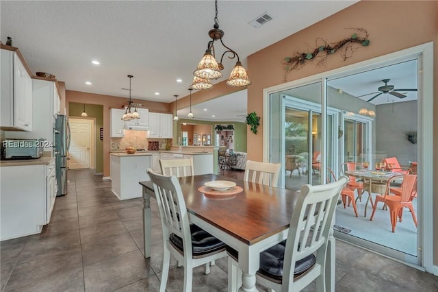 dining space featuring ceiling fan