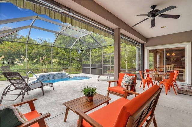 view of patio with ceiling fan and glass enclosure