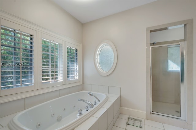 bathroom with tile patterned flooring and plus walk in shower