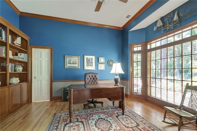 office space featuring ornamental molding, light hardwood / wood-style floors, and ceiling fan