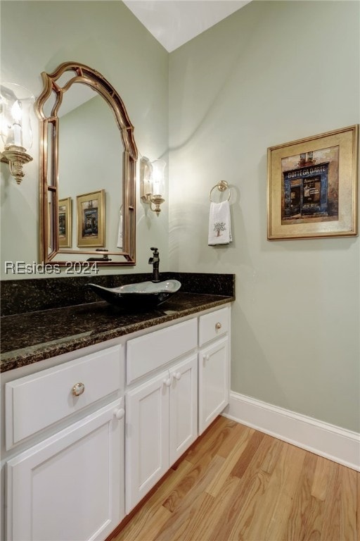 bathroom featuring vanity and hardwood / wood-style flooring