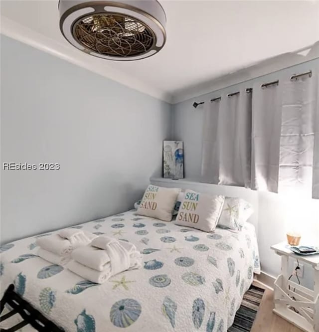 bedroom featuring hardwood / wood-style floors