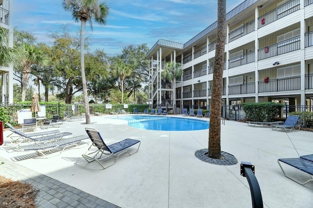 view of swimming pool with a patio area