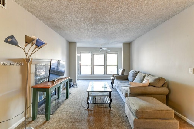 carpeted living room with ceiling fan and a textured ceiling