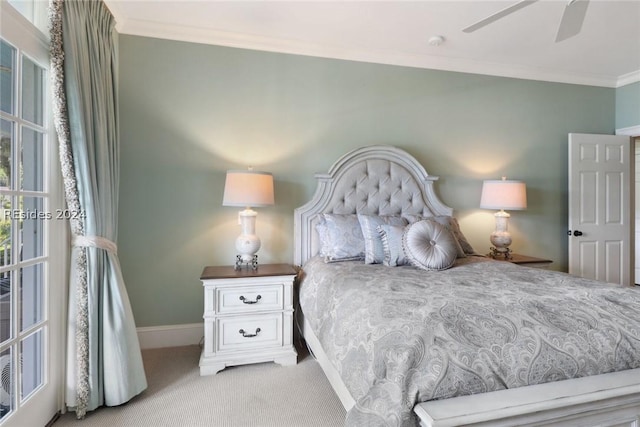 bedroom featuring crown molding, light colored carpet, and ceiling fan