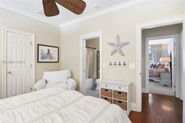 bedroom featuring dark hardwood / wood-style floors, ceiling fan, ornamental molding, and connected bathroom