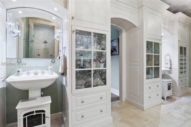 bathroom with tile patterned flooring and a shower