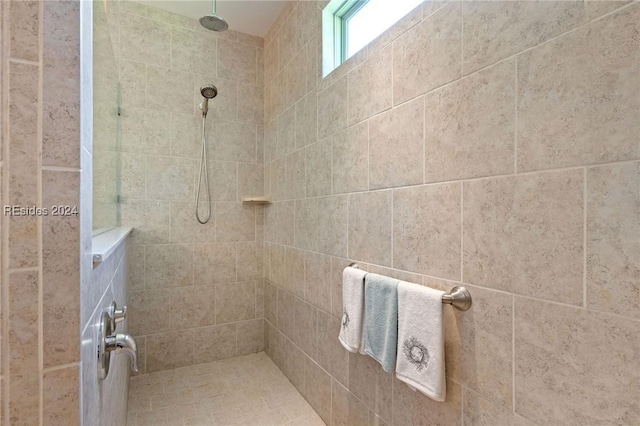 bathroom with a tile shower