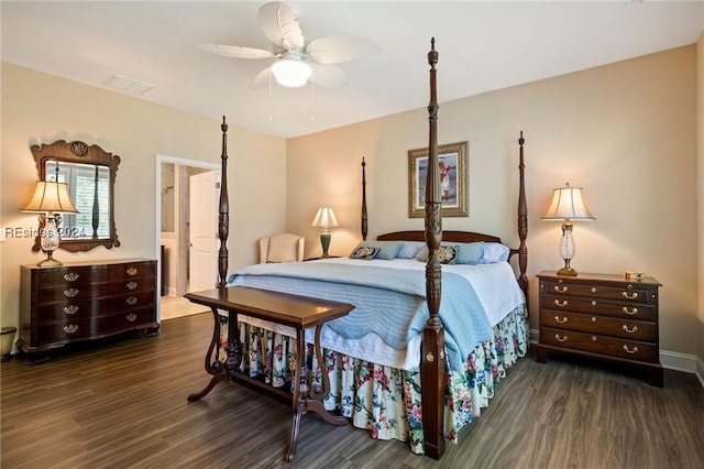 bedroom with dark wood-type flooring, connected bathroom, and ceiling fan