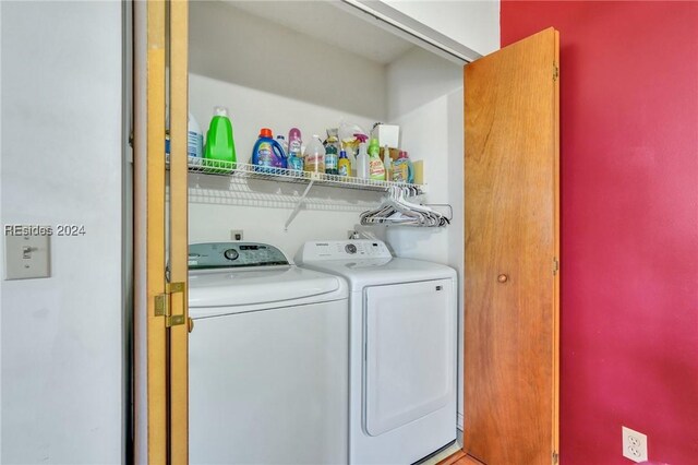 washroom featuring washer and dryer