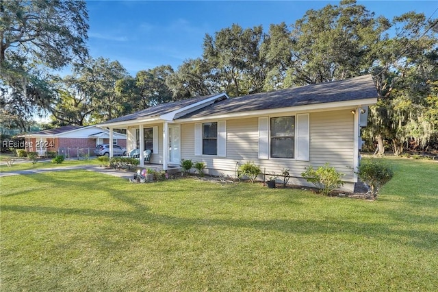 single story home featuring a front yard and covered porch