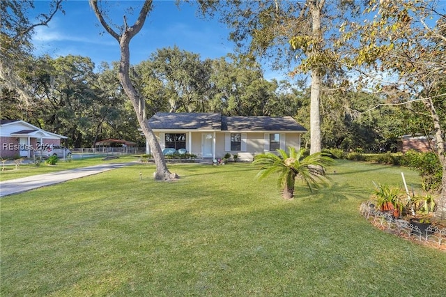 ranch-style house with a front lawn