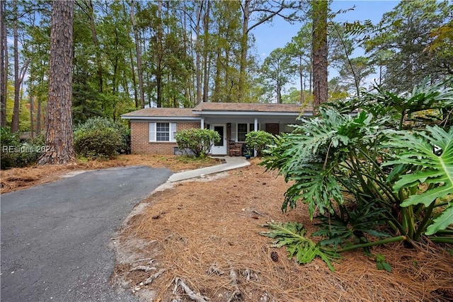 ranch-style home with covered porch