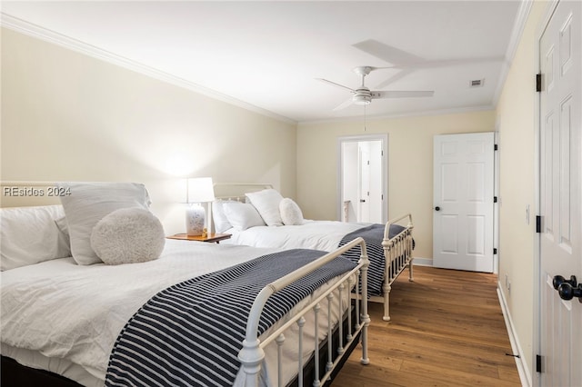 bedroom featuring ceiling fan, ornamental molding, and dark hardwood / wood-style flooring