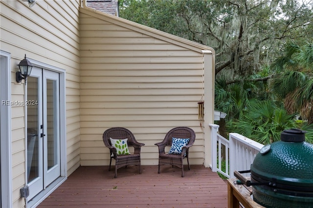 wooden terrace featuring grilling area