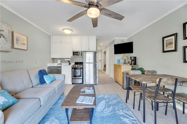 living room featuring light tile patterned floors, crown molding, and ceiling fan