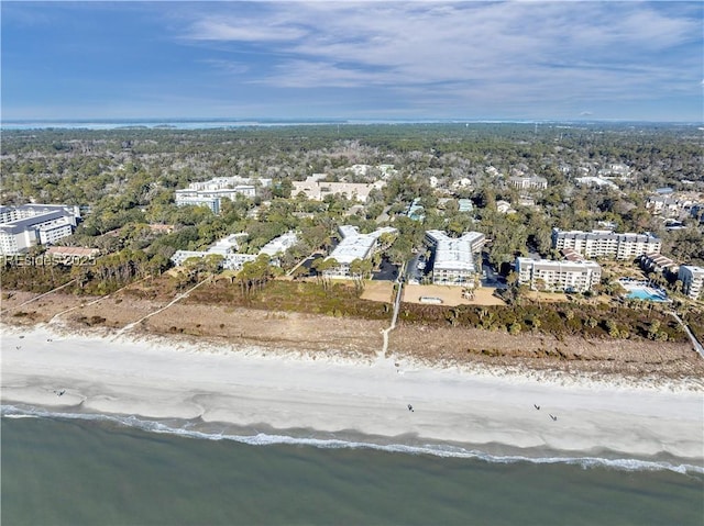 birds eye view of property featuring a beach view and a water view