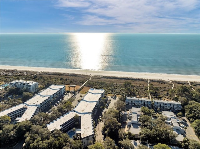 aerial view featuring a water view and a beach view