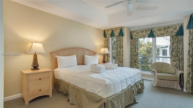 bedroom featuring ceiling fan and carpet