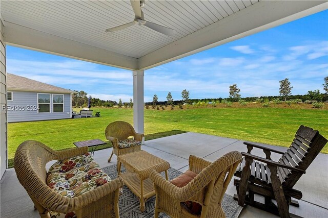 view of patio featuring ceiling fan