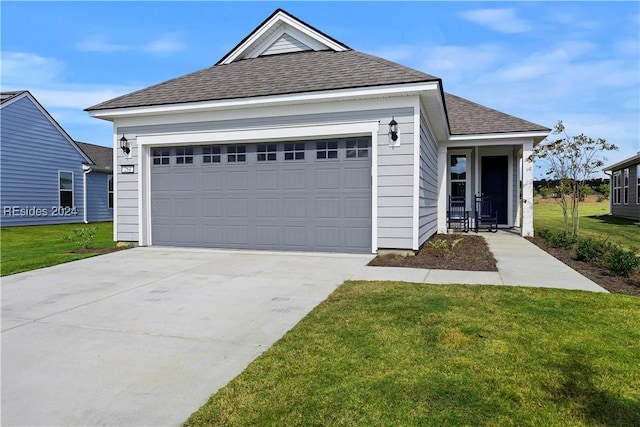 view of front of house with a garage and a front lawn